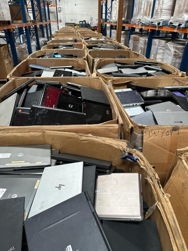 Stacked laptops in boxes