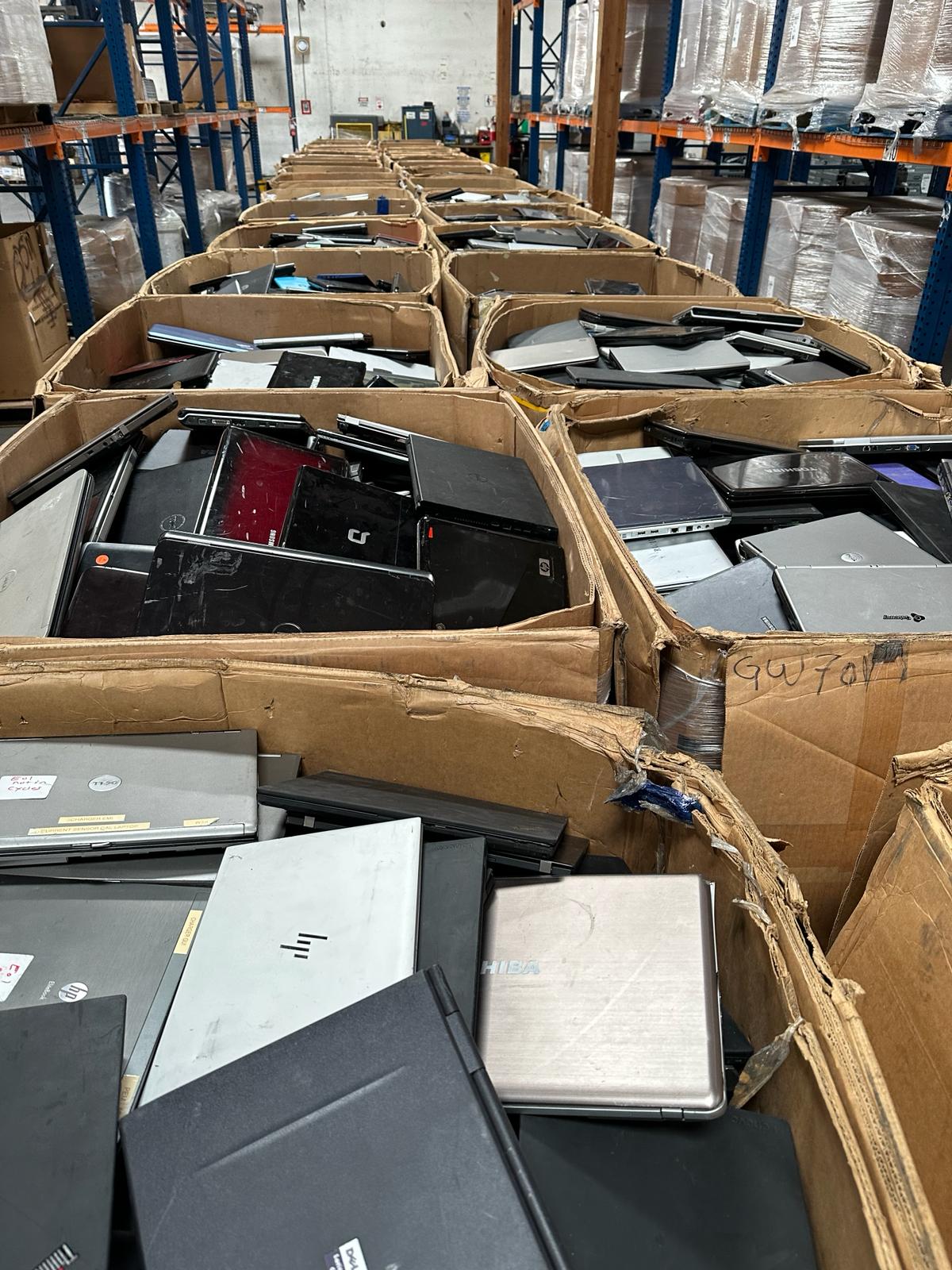 Stacked laptops in boxes