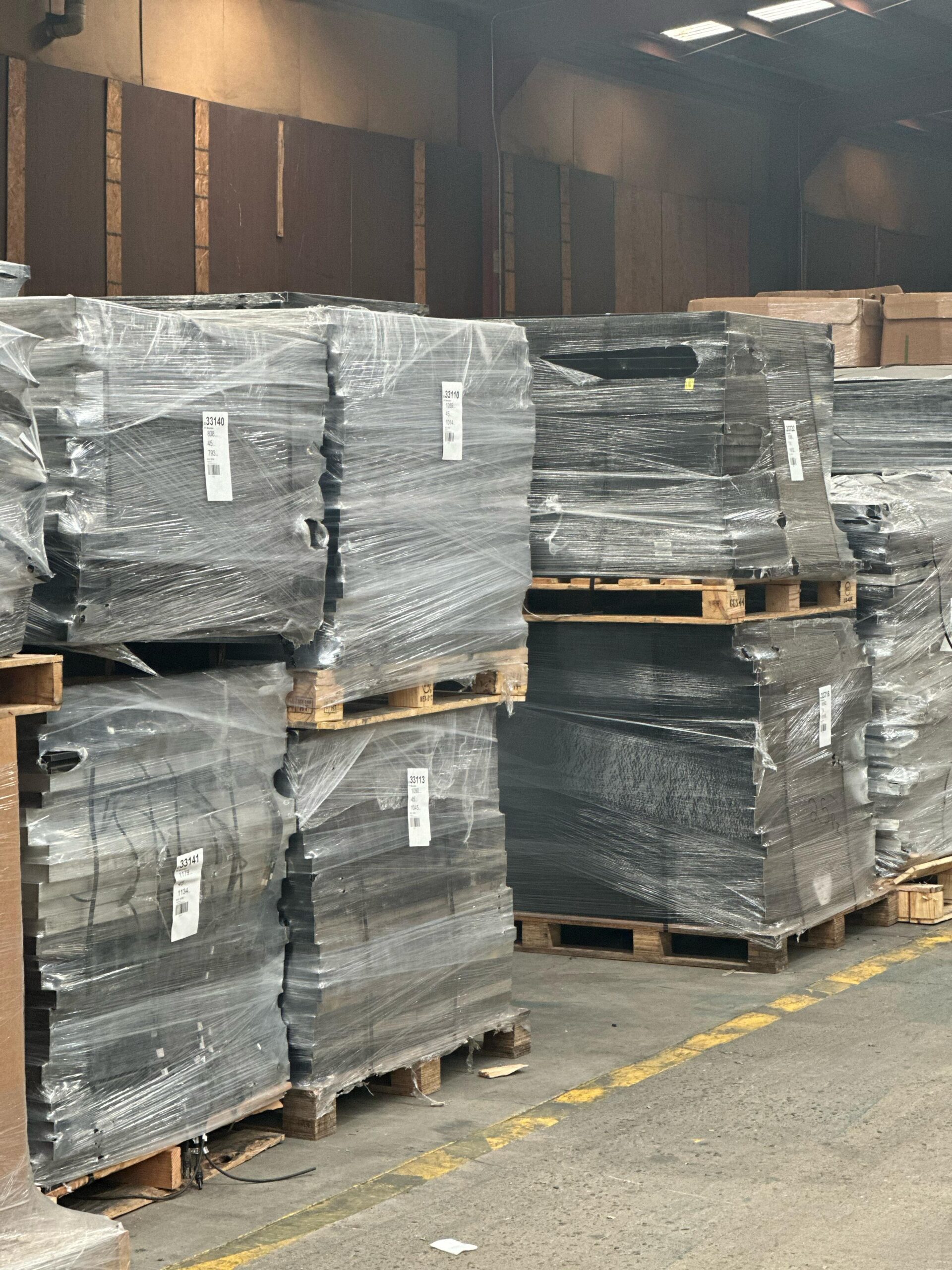 A stack of wooden pallets in a warehouse.